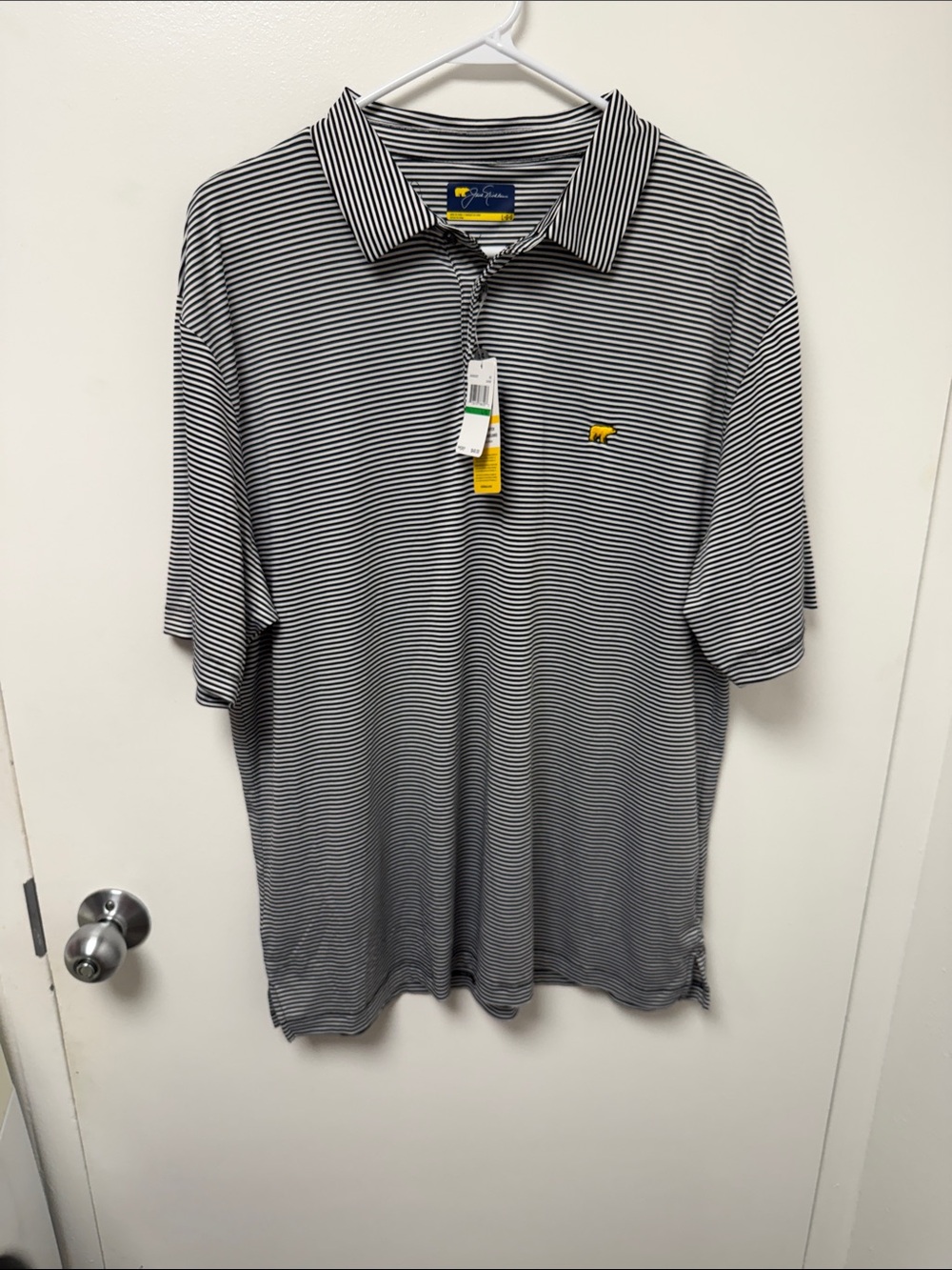 Jack Nicklaus Men's Short-Sleeve Black and White Striped Polo with Yellow Logo